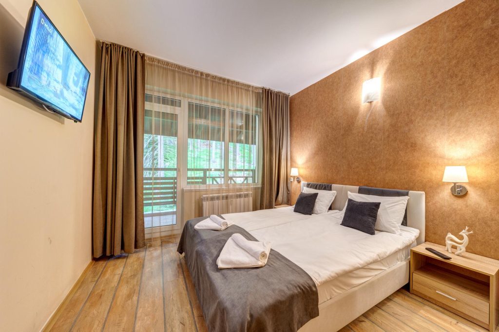 Спалнята на апартамента с една спалня в The Stream Resort Pamporovo