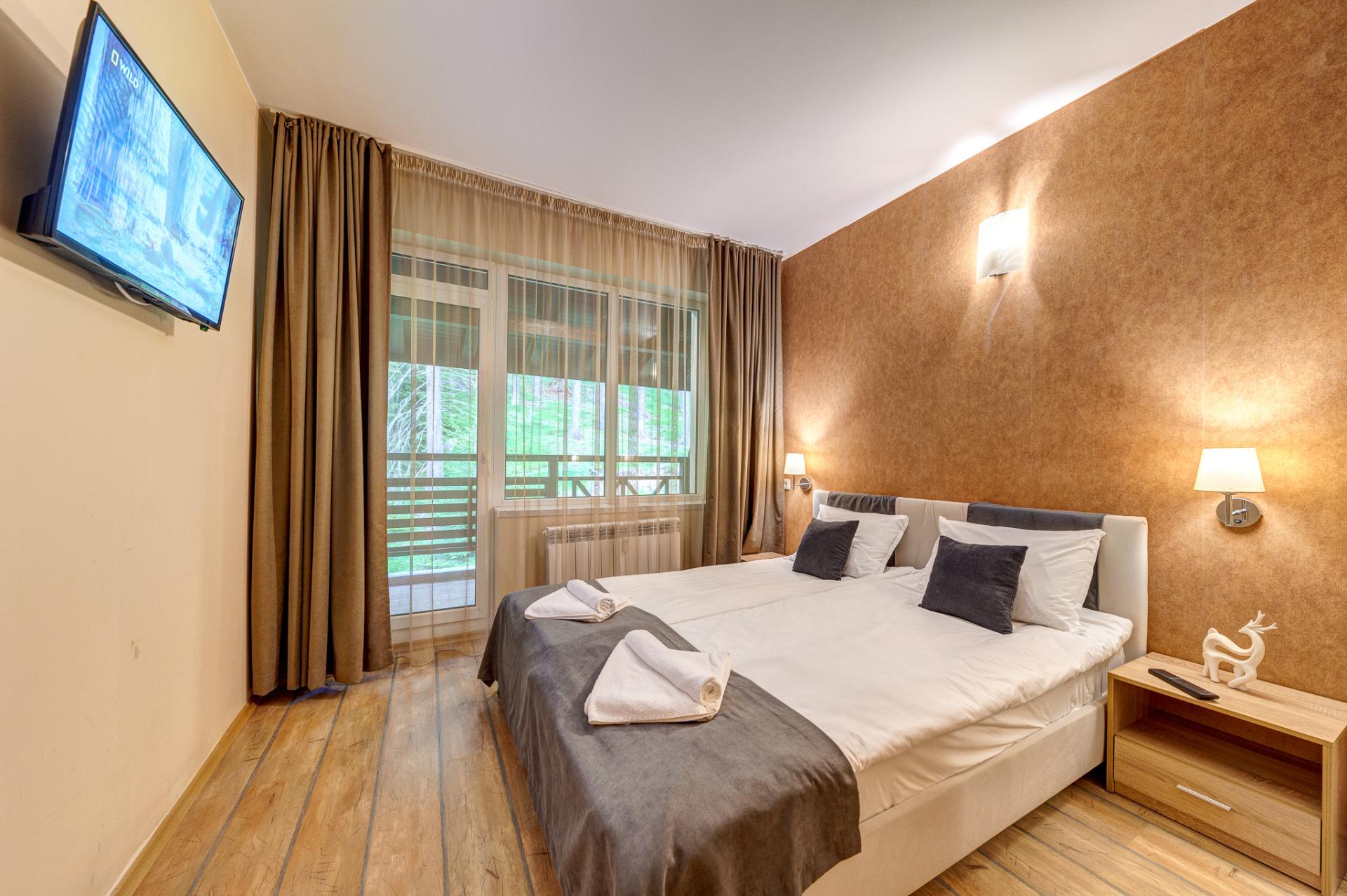 Спалнята на апартамента с една спалня в The Stream Resort Pamporovo